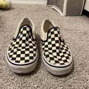 Black and white checkered Vans.